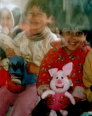 Romanian hospitalized orphans with plush doll gifts